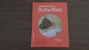 Paige explores the butterfly book for you, featuring large images and beautiful descriptions.